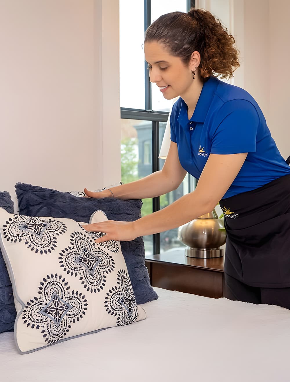 maid from Maid Bright making a bed